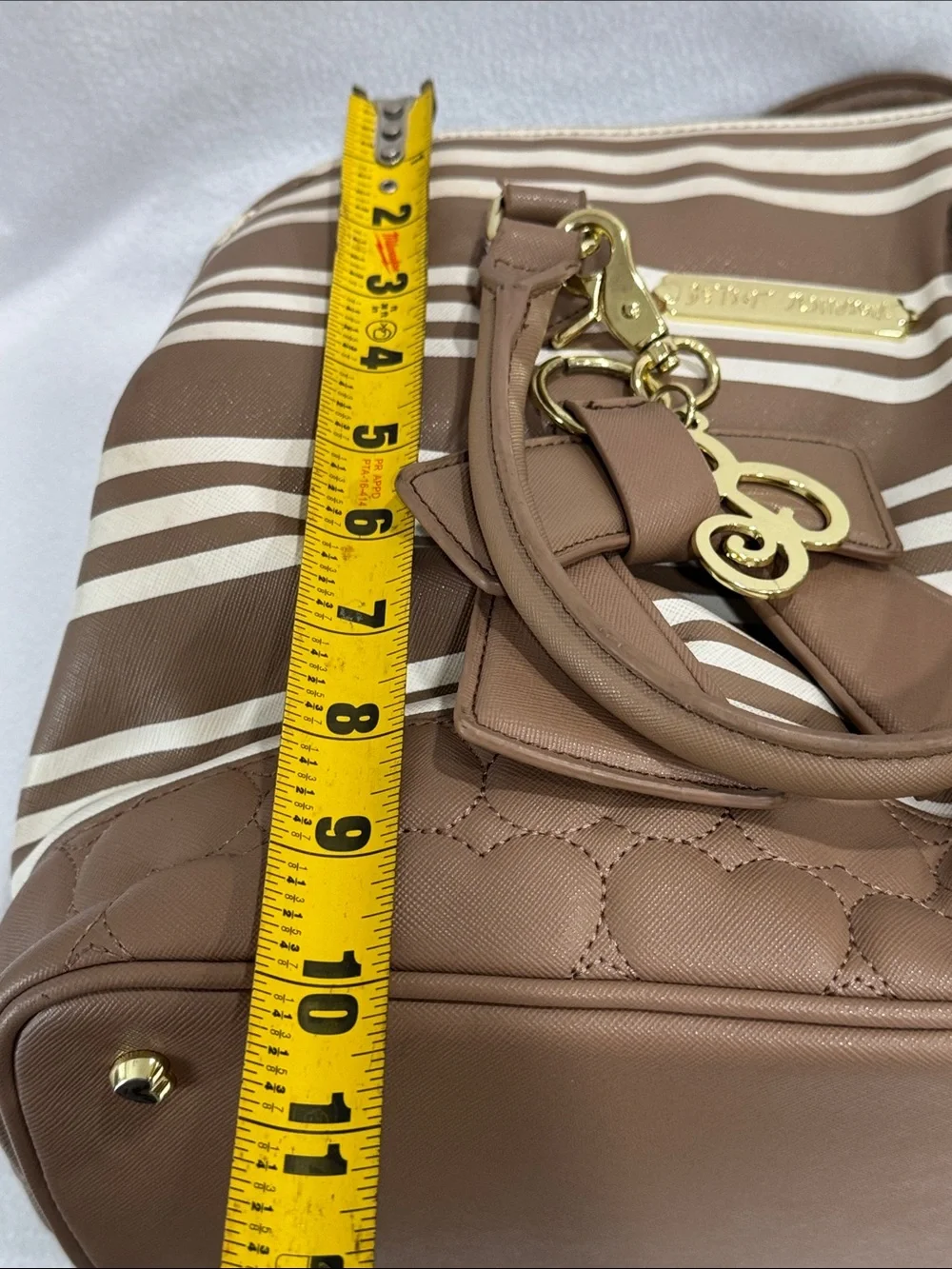 Betsey Johnson Brown and Cream Striped Satchel with Bow Charm